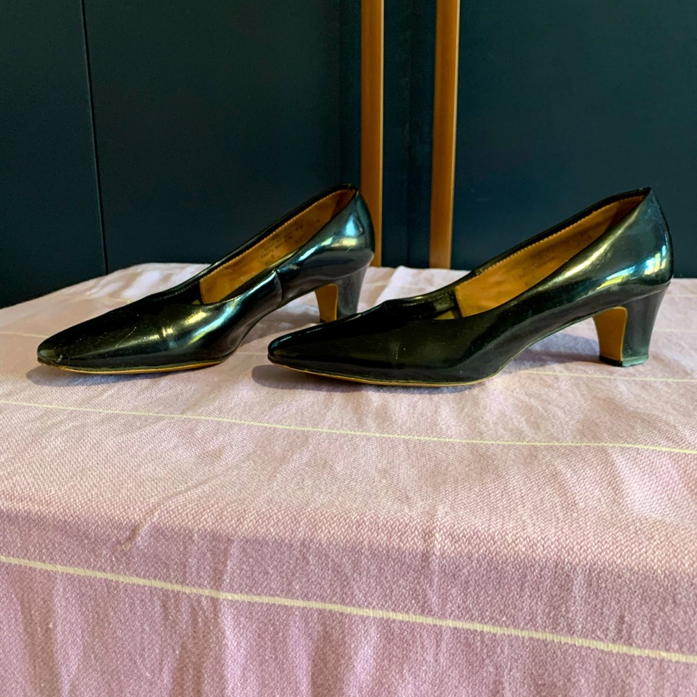 Black faux leather kitten heels.